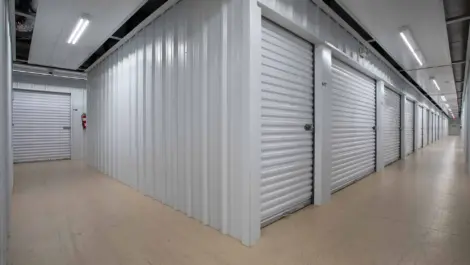View of interior storage units with white doors.