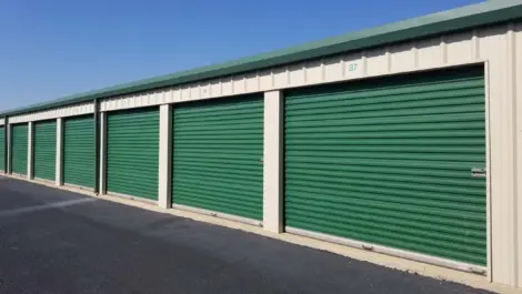 Exterior of green storage units at Springdale, AR, Superior Storage facility.